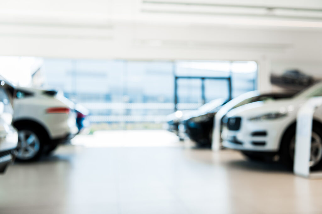 Blurred car showroom with new and luxury cars – Tinocars Vigo